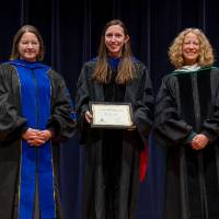 Awardee posing with Provost and Christine Rener